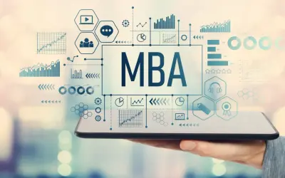 Gráficos y datos financieros sobre una pantalla de tablet, con el texto "MBA" en el centro. Ideal para un curso de mba finanzas.