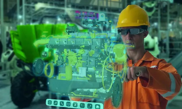 Ingeniero con gafas de realidad aumentada interactúa con un modelo 3D de motor, mostrando la innovación tecnológica en la industria.